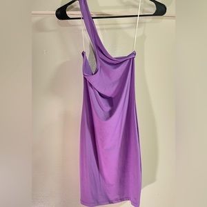 A symmetrical off shoulder dress